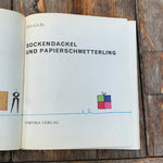 Sockendackel und Papierschmetterling