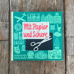 Mit Papier und Schere